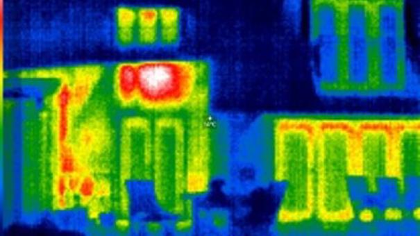 Thermal image of a home showing a hot spot on the external wall where an internal radiator is fitted.