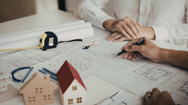two people planning a housing development