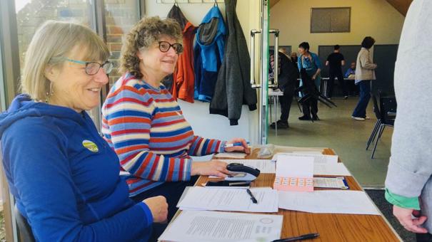 pecan representatives welcome visitors to the repair cafe